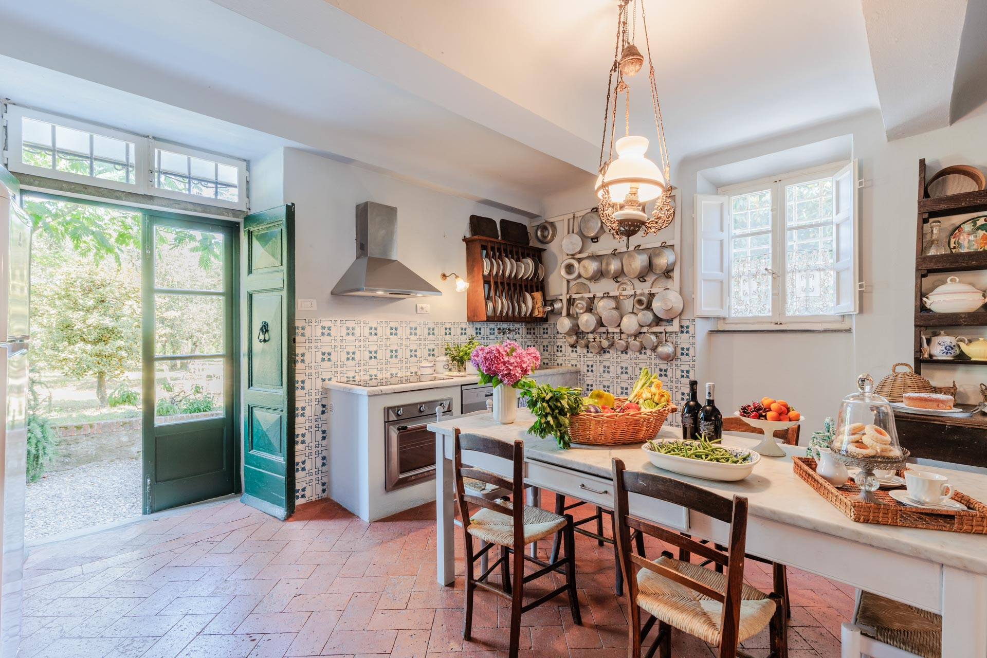 Traditional Tuscan kitchen with blue and white tiles